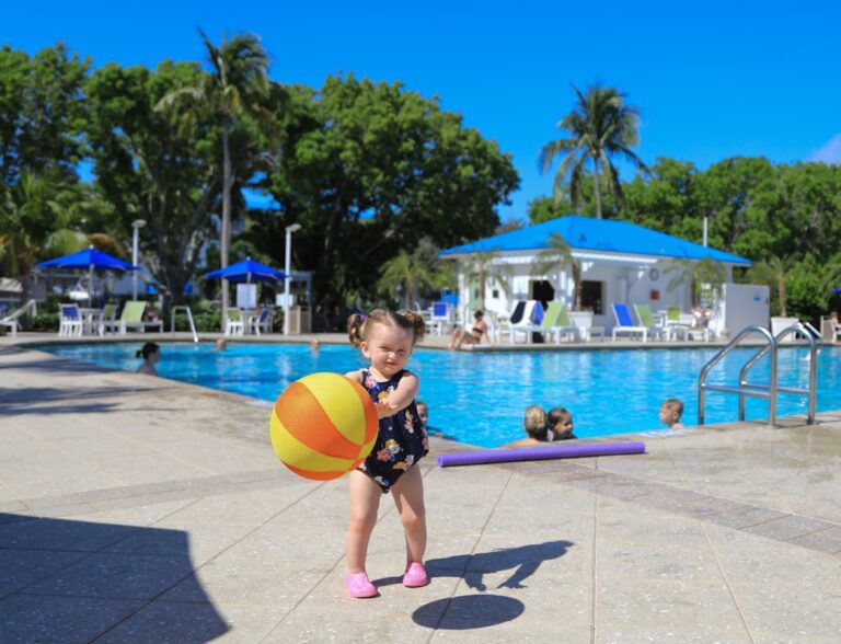 Outdoor Pool Deck and Little Girl with Beachvall
